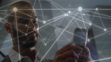 Animation-of-network-of-connections-over-caucasian-businessman-using-smartphone