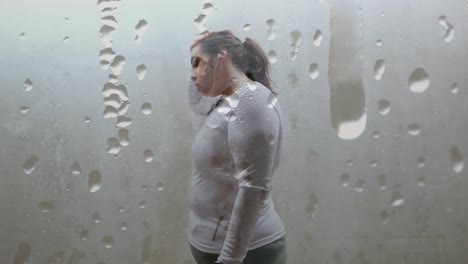 Animation-of-drops-of-rain-over-plus-size-caucasian-woman-exercising-in-city