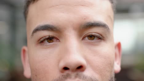 Close-up-portrait-of-eyes-of-biracial-man-at-office