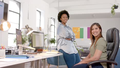 Portrait-of-happy-diverse-business-female-colleagues-in-casual-office-meeting,-slow-motion