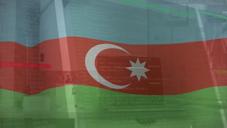 Animation-of-flag-of-azerbaijan-over-computer-interface-against-laptop-on-desk-in-office