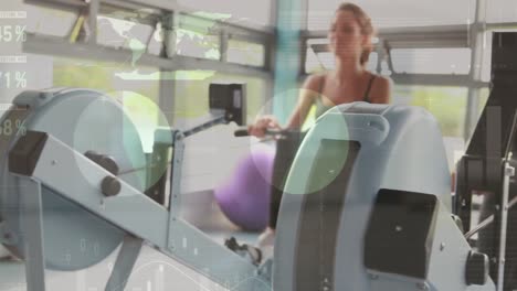 Animation-of-infographic-interface-over-caucasian-females-doing-seated-cable-rows-in-gym