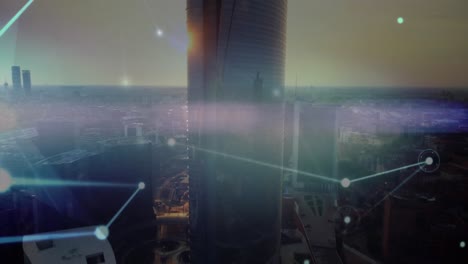 Animation-of-dots-connected-with-lines-over-aerial-view-of-modern-city-against-sky