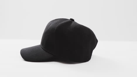 Video-of-black-baseball-cap-and-copy-space-on-white-background