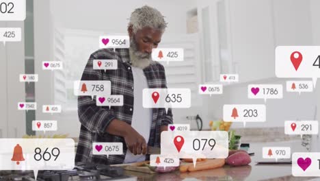 Animation-of-multiple-notification-bars,-senior-african-american-man-cutting-vegetables-in-kitchen
