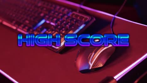 Animation-of-high-score-text,-video-game-keyboard-and-mouse-on-neon-background