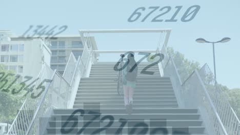 Animation-of-changing-numbers,-graphs,-rear-view-of-man-carrying-bicycle-while-walking-up-stairs