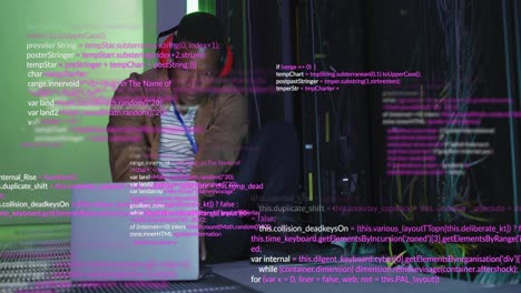 Animation-of-data-processing-over-african-american-male-engineer-with-laptop-working-at-server-room