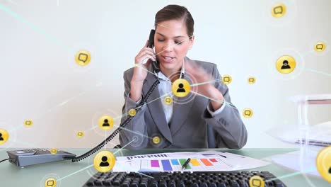 Animation-of-connected-icons-over-caucasian-female-receptionist-talking-on-phone-in-office