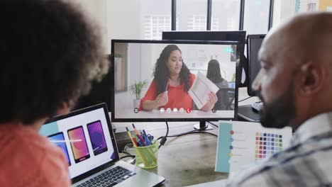 African-american-business-people-on-video-call-with-caucasian-female-colleague-on-screen