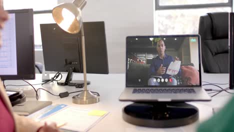 Laptop-video-call-with-african-american-male-colleague-on-screen