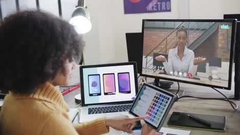 African-american-businesswoman-on-video-call-with-african-american-female-colleague-on-screen