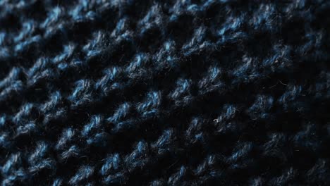 Micro-video-of-close-up-of-blue-wooly-crochet-fabric-with-copy-space