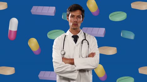 Animation-of-floating-pills-and-caucasian-male-doctor-with-arms-crossed-on-blue-background