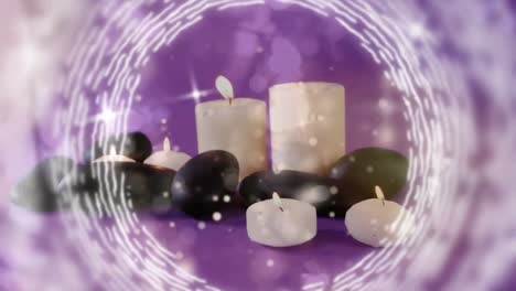 Animation-Von-Weißen-Lichtpunkten-über-Brennenden-Kerzen-Und-Steinen