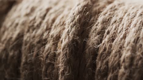 Micro-video-of-close-up-of-grey-woolly-threads-with-copy-space