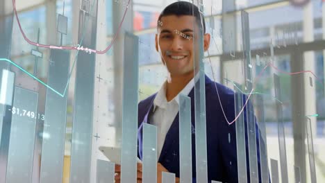 Animation-of-data-processing-over-portrait-of-biracial-businessman-holding-tablet-smiling-at-office
