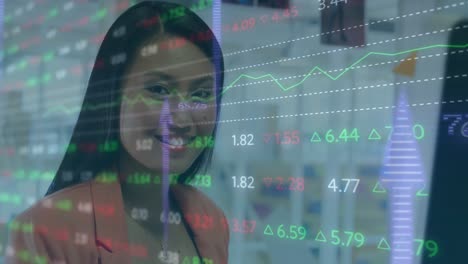 Animation-of-stock-market-data-processing-against-portrait-of-asian-businesswoman-smiling-at-office