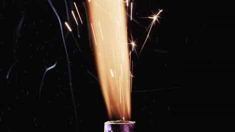 Video-of-torch-with-yellow-flame-and-sparks-and-copy-space-on-black-background