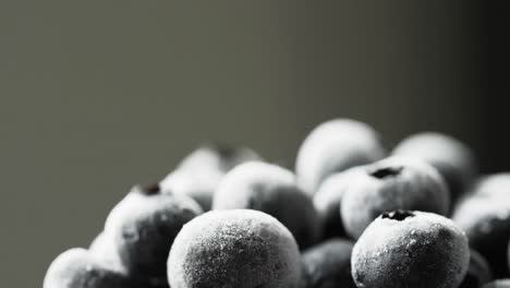 Micro-video-of-blueberries-with-copy-space-on-grey-background