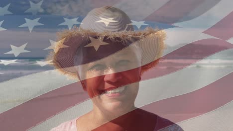 Animation-of-flag-of-usa-over-happy-senior-biracial-woman-on-beach