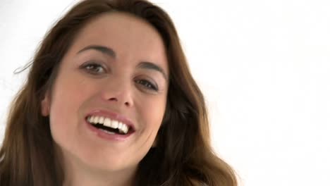 Close-up-of-a-joyful-hispanic-woman-smiling-at-the-camera