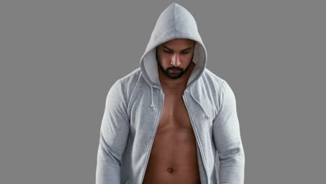 Muscular-man-wearing-grey-hood-