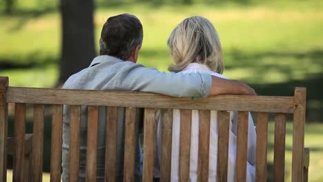 Senior-couple-relaxing-on-a-bench