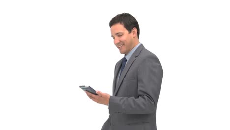 Smiling-businessman-using-a-computer-tablet