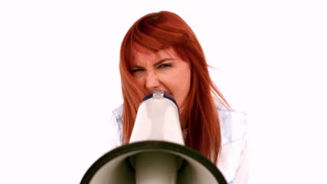 Angry-businesswoman-screaming-in-a-megaphone