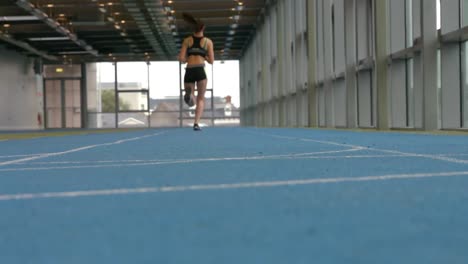 Woman-racing-on-indoor-track