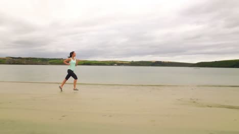 Fit-woman-running-on-the-sand