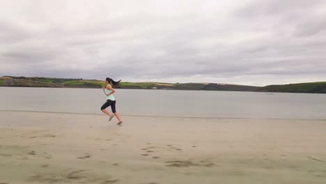 Fit-woman-running-on-the-sand