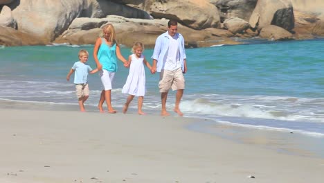 Family-walking-on-a-beach