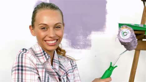 Pretty-girl-with-brush-smiling-at-the-camera
