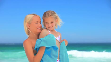 Attractive-blonde-woman-drying-her-daughter-wih-a-towel
