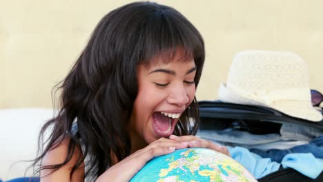 Smiling-woman-with-globe