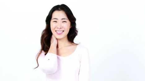 Pretty-Asian-woman-smiling-at-the-camera