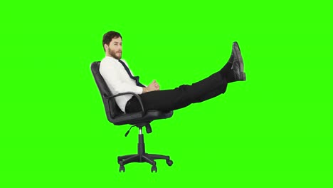 Geschäftsmann-Entspannt-Sich-In-Seinem-Stuhl-Mit-Erhobenen-Beinen