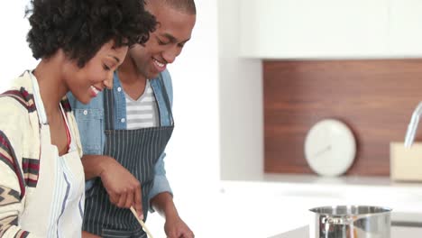 Happy-young-couple-cooking-together