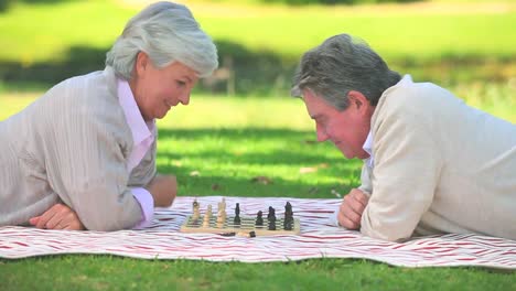 Mature-couple-playing-chess-