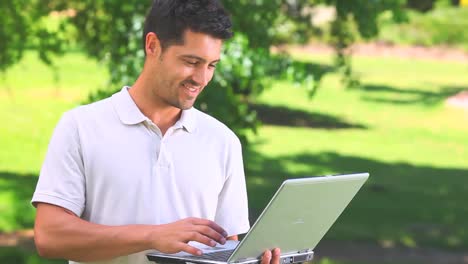 Young-man-chatting-on-his-laptop