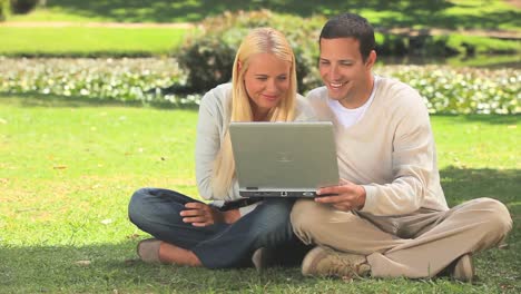 Young-couple-on-their-laptop