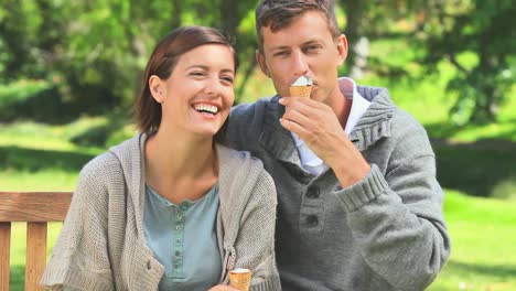 Young-couple-eating-icecream-outdoors