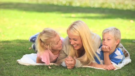 Young-woman-having-fun-with-her-two-children