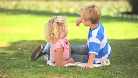 Young-boy-and-his-sister-talking-
