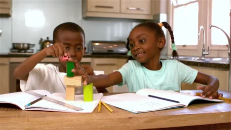 Cute-black-siblings-playing-in-kitchen