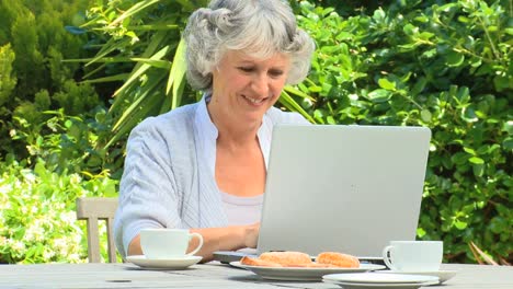 Mature-woman-working-on-her-laptop