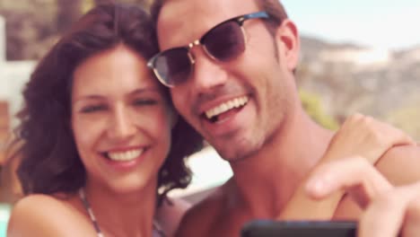 Smiling-couple-taking-a-selfie-