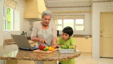 Woman-cooking-with-her-grandson